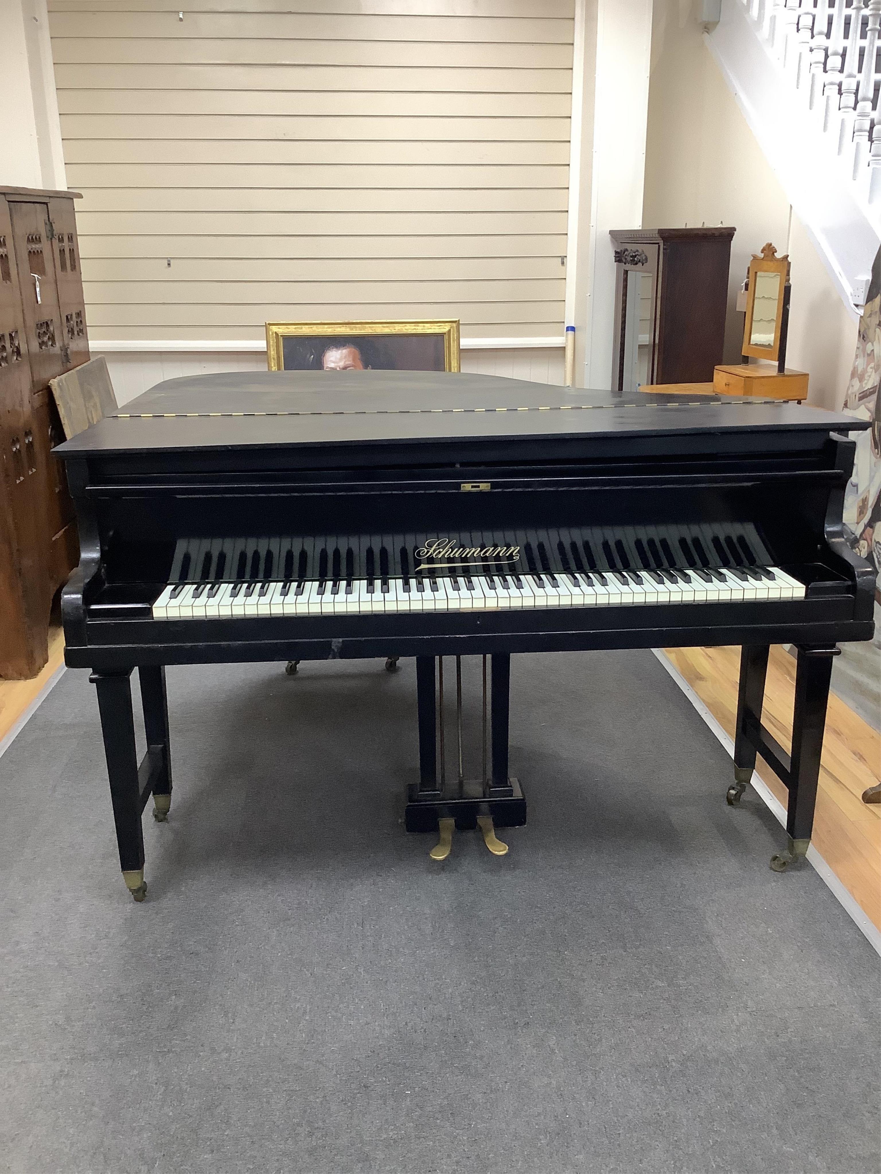 An early 20th century Schumann ebonised boudoir grand piano, length 154cm, width 156cm, height 100cm. Condition - poor